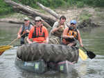 Using a double wide to float tractor tires down the river