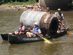 A hog feeder being removed on a canoemaran